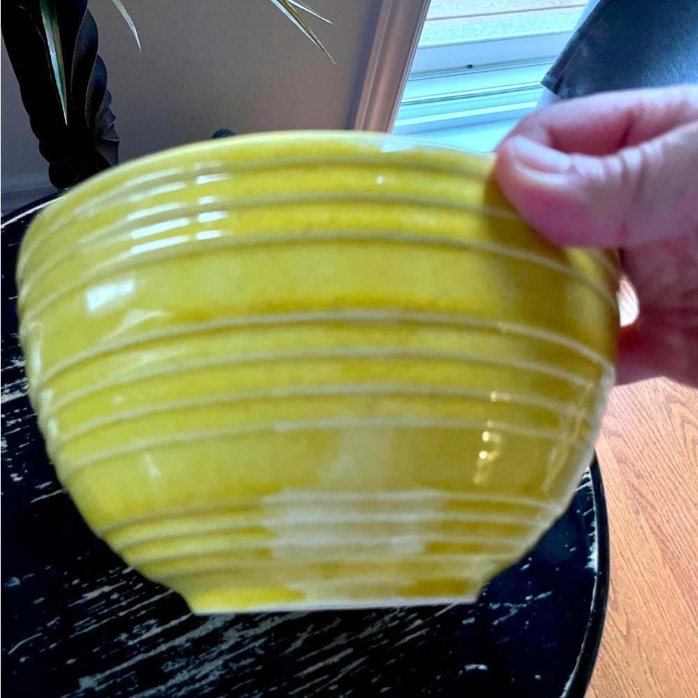 Vintage McCoy pottery yellow bowl with standard vintage wear. Stamped.